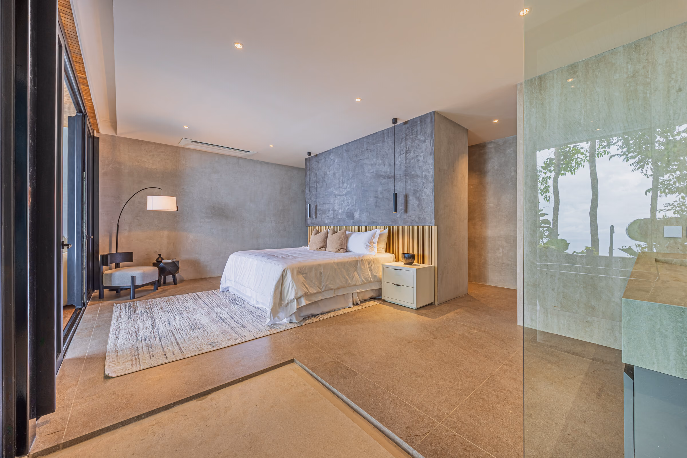 A guest bedroom with ensuite, glazed to the canopy on two sides.